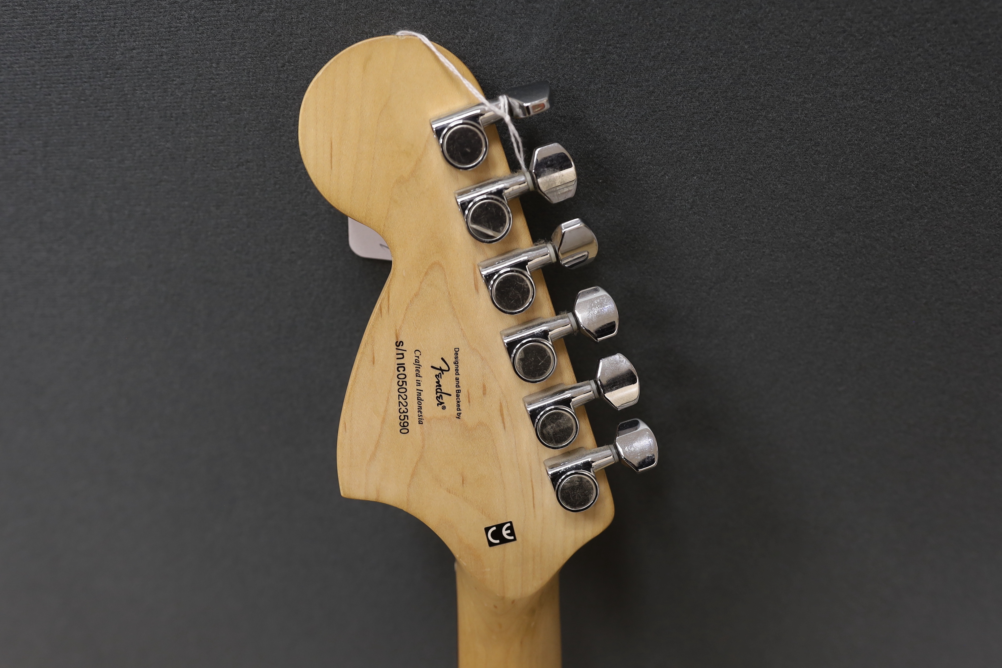 A Fender Squier Strat electric guitar with a soft case